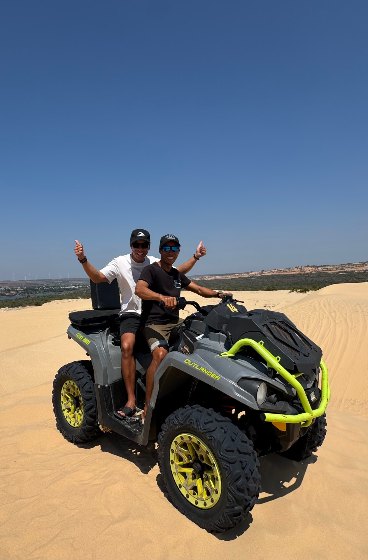 Lý and Fred on a quad bike in the Mui Ne sand dunes
